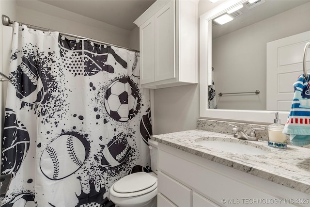 bathroom with vanity and toilet