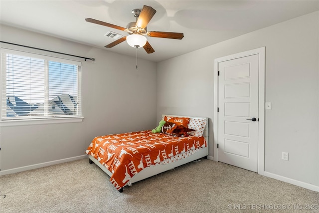 bedroom with ceiling fan and light colored carpet