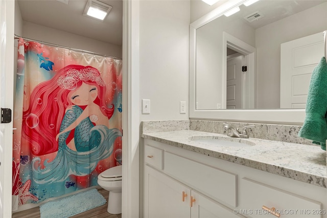 bathroom featuring vanity, toilet, curtained shower, and wood-type flooring