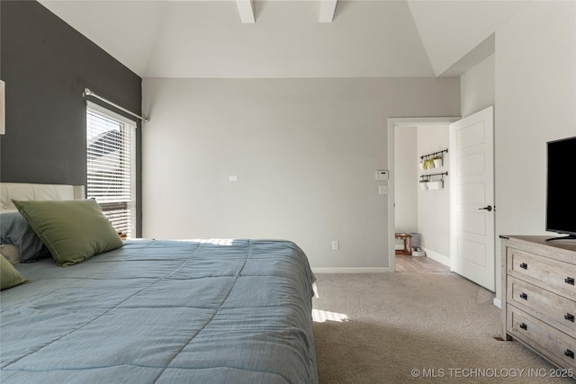 carpeted bedroom featuring vaulted ceiling with beams