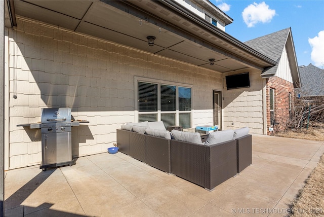 view of patio with a grill and outdoor lounge area