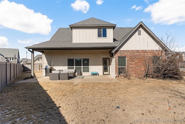 rear view of property with outdoor lounge area and a patio