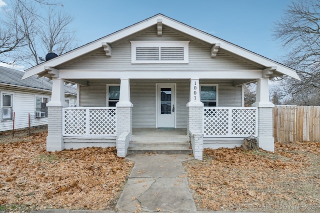 bungalow-style house with cooling unit and covered porch