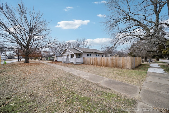 view of property exterior with a porch