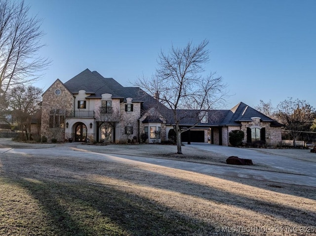 3715 Lionel Ln, Durant, OK 74701 - view of front facade with a garage and a balcony