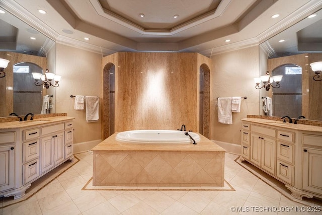 bathroom with crown molding, vanity, a tray ceiling, tile patterned floors, and independent shower and bath