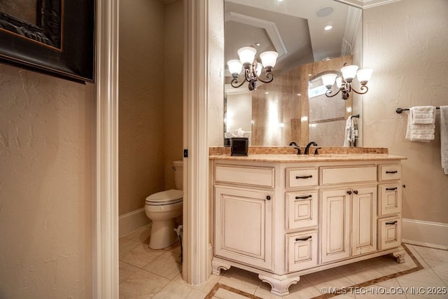 bathroom featuring vanity, a chandelier, and toilet