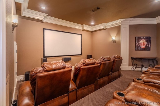 home theater room with carpet floors and ornamental molding