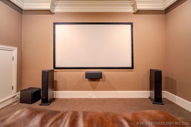 carpeted home theater featuring crown molding