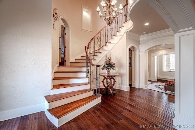 stairway featuring hardwood / wood-style flooring and ornamental molding