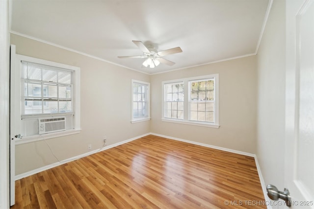 unfurnished room featuring crown molding, plenty of natural light, hardwood / wood-style floors, and ceiling fan