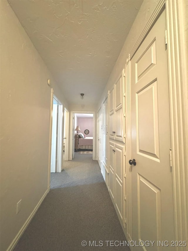 hall featuring carpet