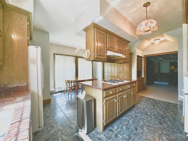 kitchen featuring pendant lighting and white appliances