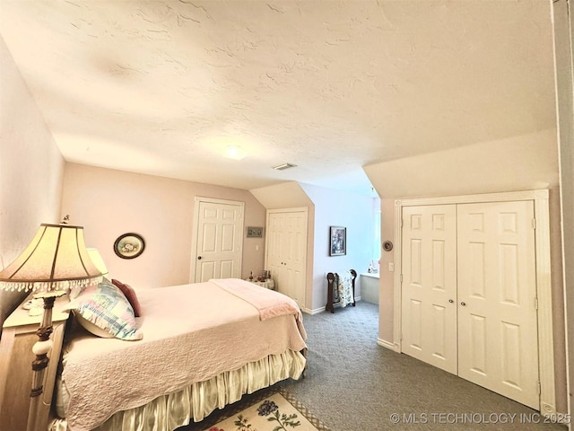 bedroom with dark carpet