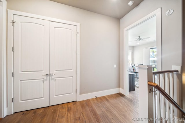 corridor featuring wood-type flooring