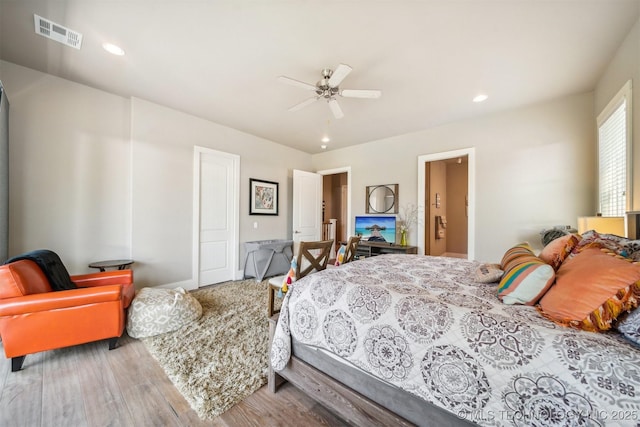 bedroom featuring hardwood / wood-style flooring and ceiling fan