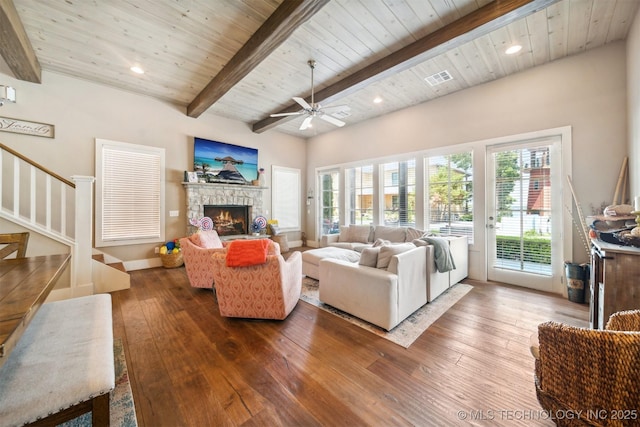 living room with beamed ceiling, hardwood / wood-style floors, and wooden ceiling