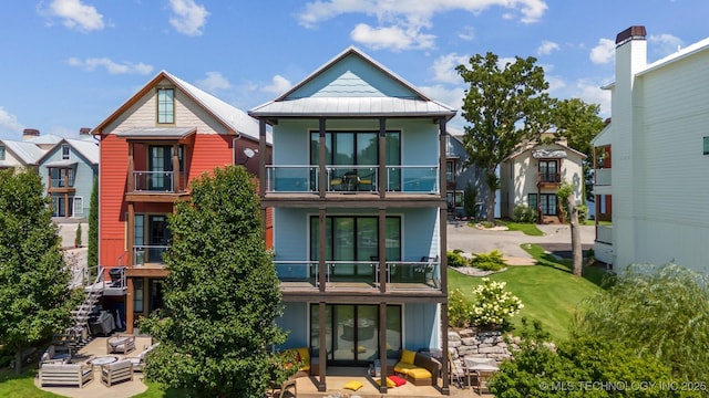 back of property with a balcony