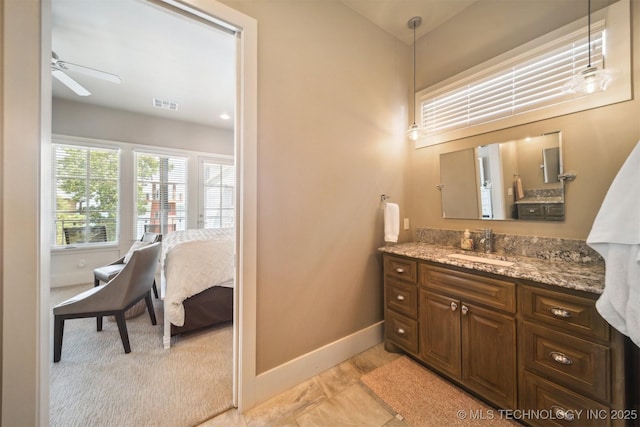 bathroom featuring ceiling fan, vanity, and tile patterned flooring