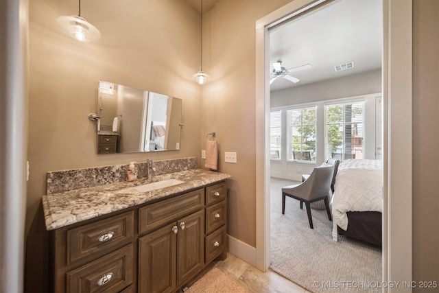 bathroom featuring vanity and ceiling fan