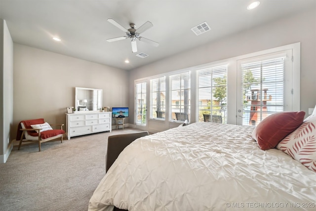 bedroom featuring multiple windows, access to outside, ceiling fan, and carpet flooring