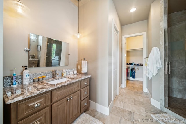 bathroom with vanity and an enclosed shower