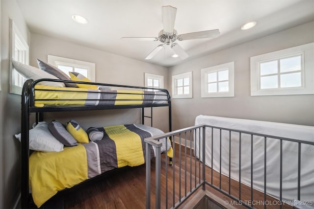 bedroom with dark wood-type flooring and ceiling fan