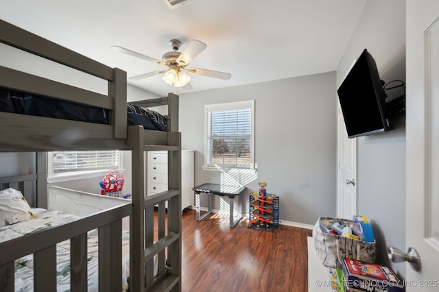 bedroom with dark wood-type flooring and ceiling fan