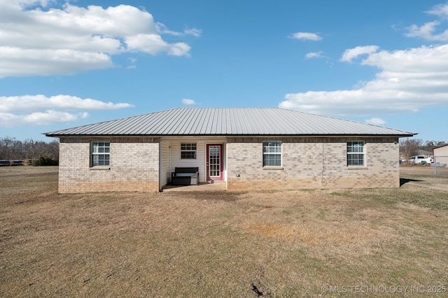 back of house with a yard