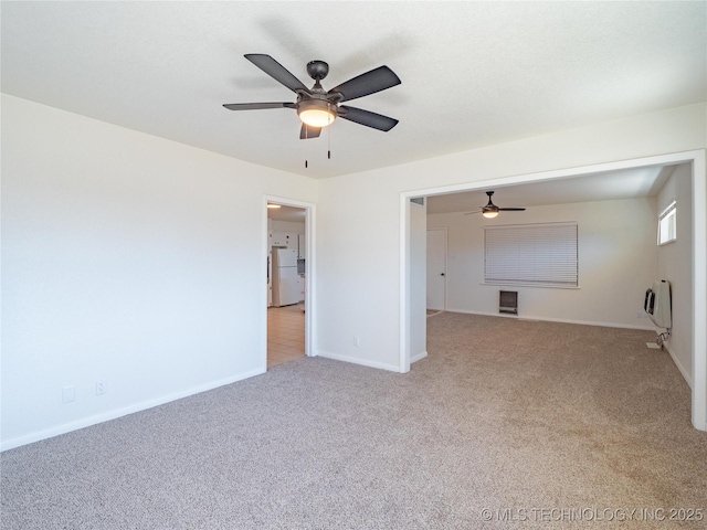 carpeted empty room with heating unit