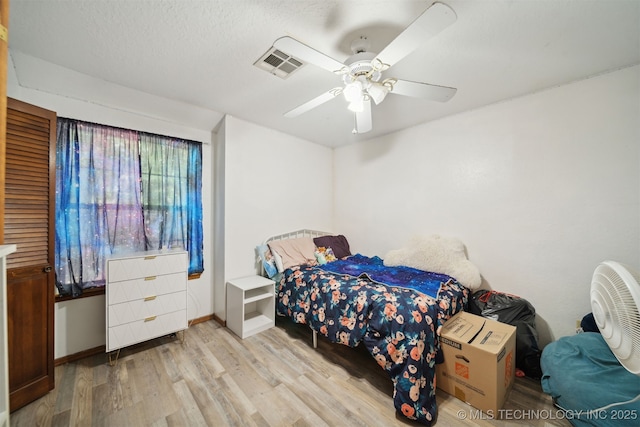 bedroom featuring ceiling fan and light hardwood / wood-style flooring