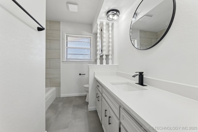 full bathroom with vanity, tiled shower / bath, and toilet