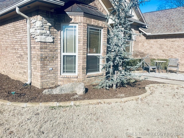 view of property exterior with a patio