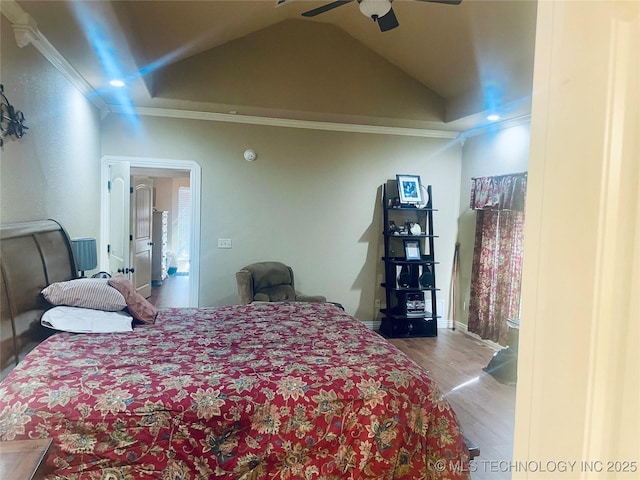 bedroom featuring ornamental molding, lofted ceiling, wood-type flooring, and ceiling fan