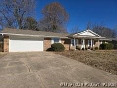 single story home with a garage