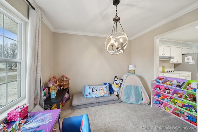 game room with a notable chandelier, carpet flooring, and ornamental molding