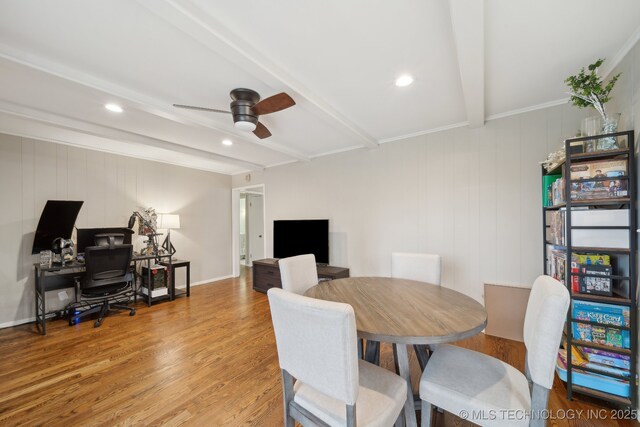 kitchen with black electric stovetop, stainless steel fridge, light tile patterned floors, and white cabinets