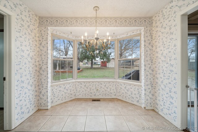 carpeted bedroom featuring ceiling fan and a textured ceiling