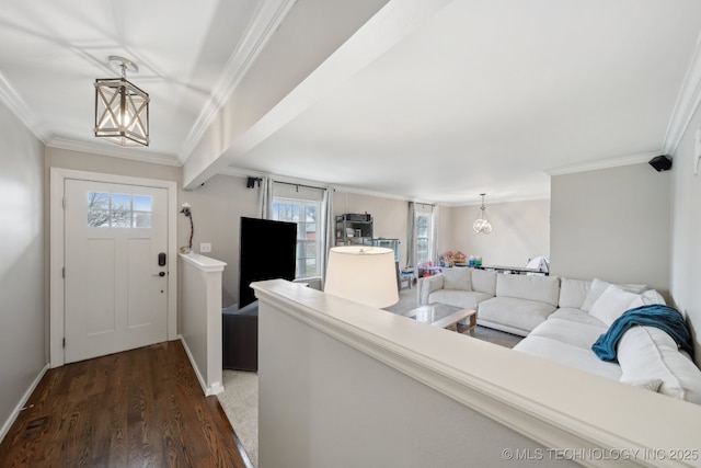 entryway featuring dark wood-style floors, baseboards, and ornamental molding