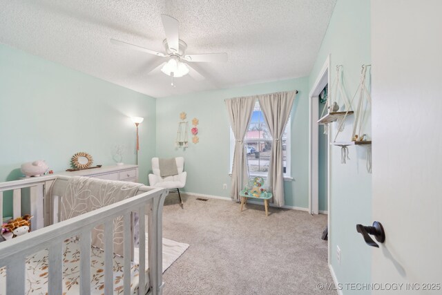 bathroom with toilet, tile patterned flooring, and a textured ceiling