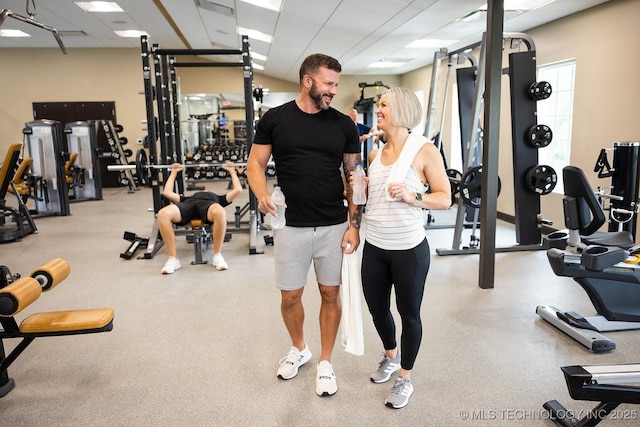 workout area featuring a drop ceiling