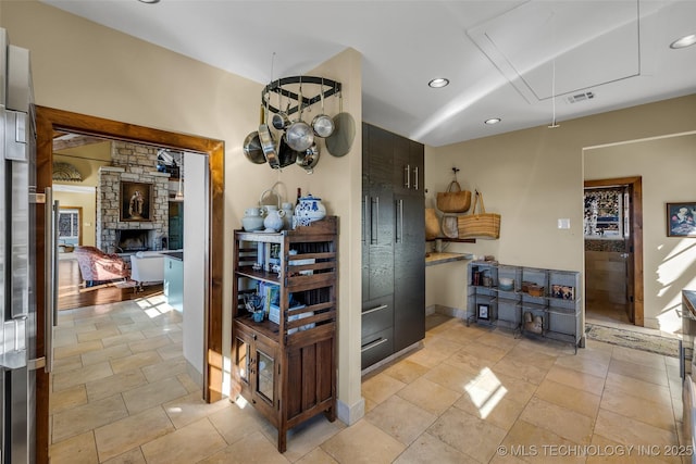 kitchen with a stone fireplace