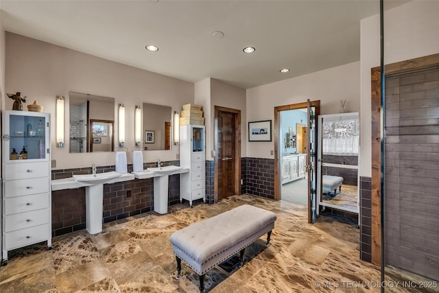 bathroom featuring double sink