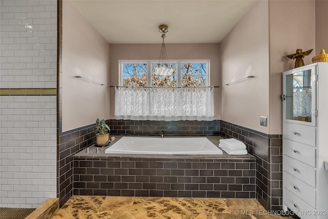 bathroom featuring tiled bath