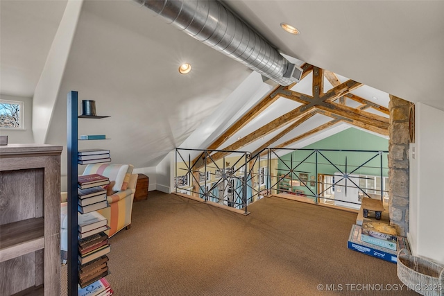 additional living space featuring lofted ceiling with beams and carpet floors