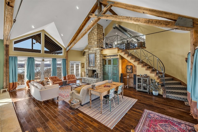 living room featuring beam ceiling, a fireplace, high vaulted ceiling, and hardwood / wood-style flooring