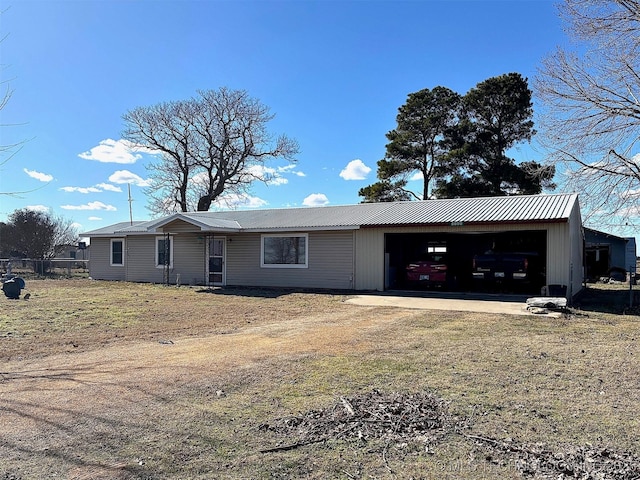 ranch-style home featuring a garage and a front lawn