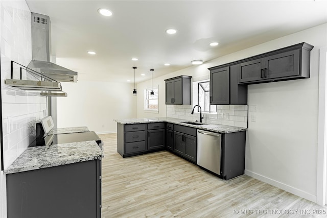 kitchen with light stone counters, pendant lighting, ventilation hood, and appliances with stainless steel finishes