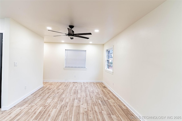 unfurnished room with ceiling fan and light hardwood / wood-style floors