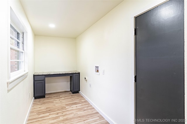 laundry room with hookup for a washing machine and light hardwood / wood-style flooring